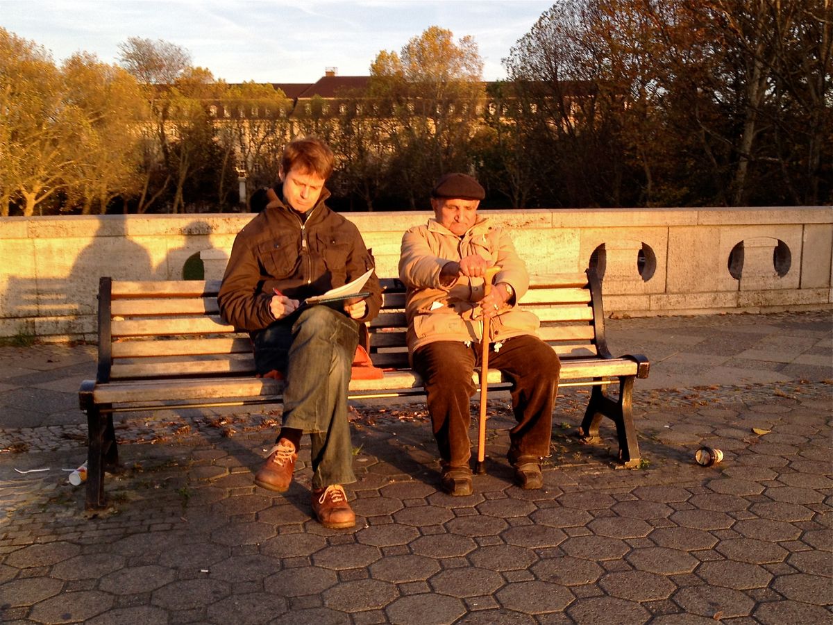 Two generations in mutual delight of the last glimpses of autumn sun